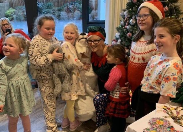 Children enjoying a festive Christmas event with residents and team members